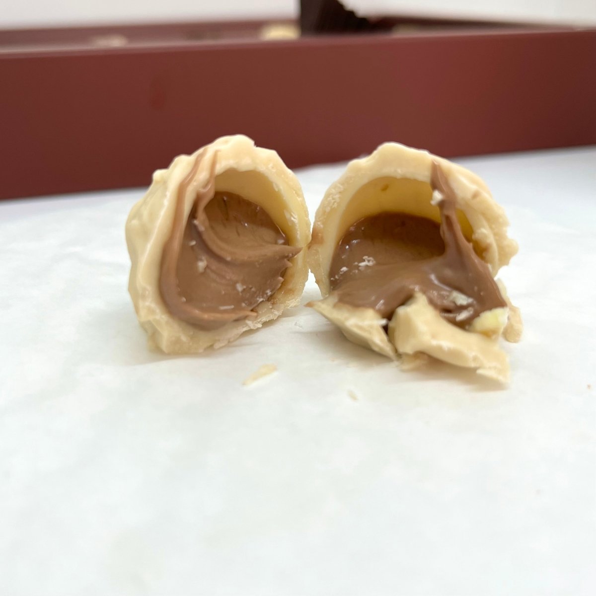 Ema Chocolate Milk and White Chocolate Truffles With Hazelnut Cream - 250g - TryAladdin