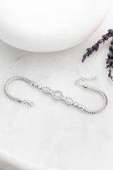 Nereze | Rhodium Plated Herringbone Chain Bracelet with Inline Baguette Stones - TryAladdin