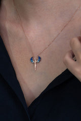 Taki | Hugging Couple Silver Necklace with Blue Stone Michael Angel Wings - TryAladdin